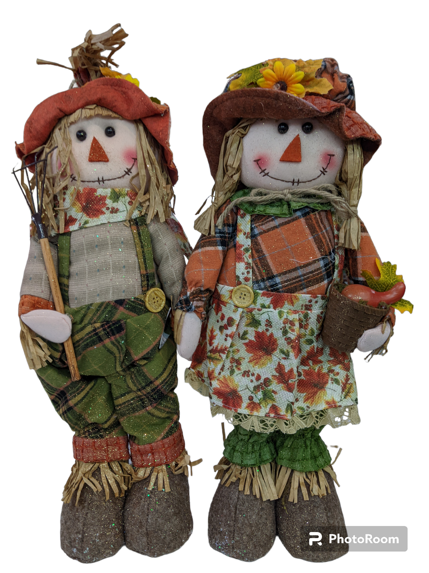 Two standing harvest scarecrows with fall print clothing and gold glitter embellishments