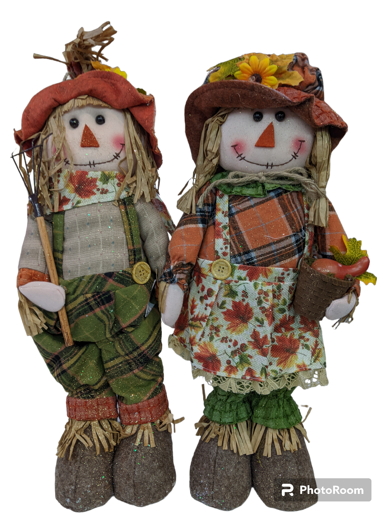 Two standing harvest scarecrows with fall print clothing and gold glitter embellishments
