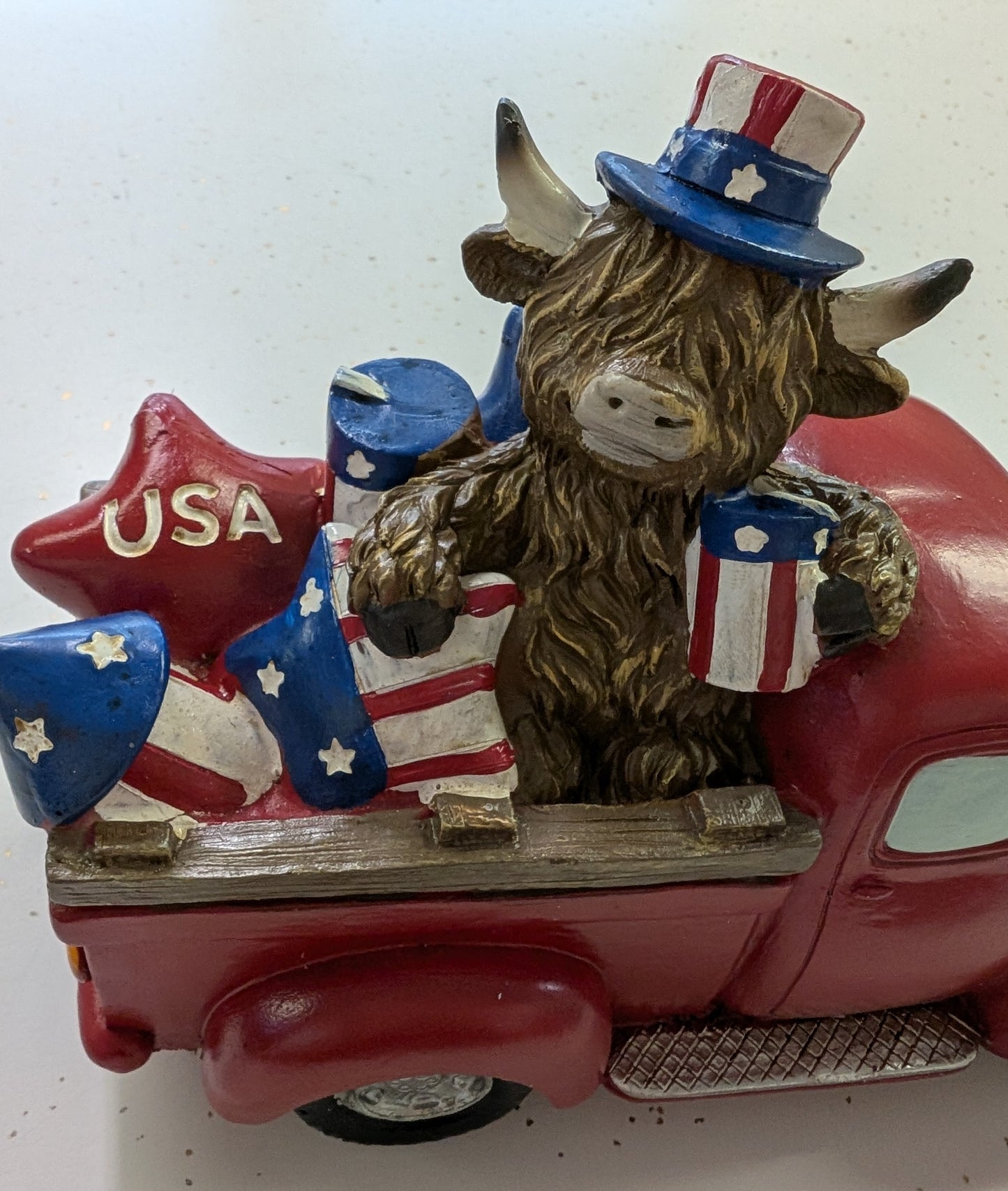 Patriotic Highland Cow Truck Figurine
