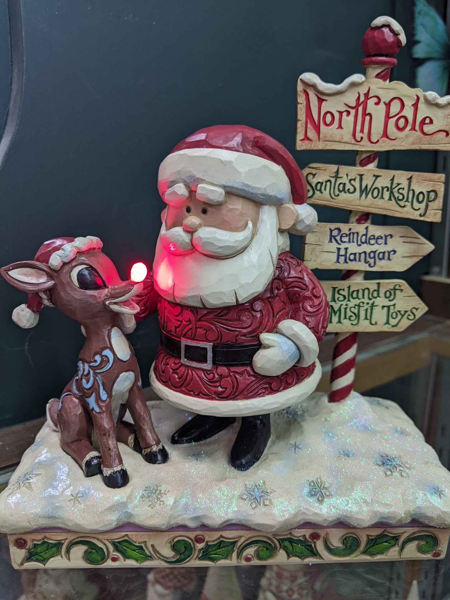 Rudolph and Santa Next to Signpost by Jim Shore