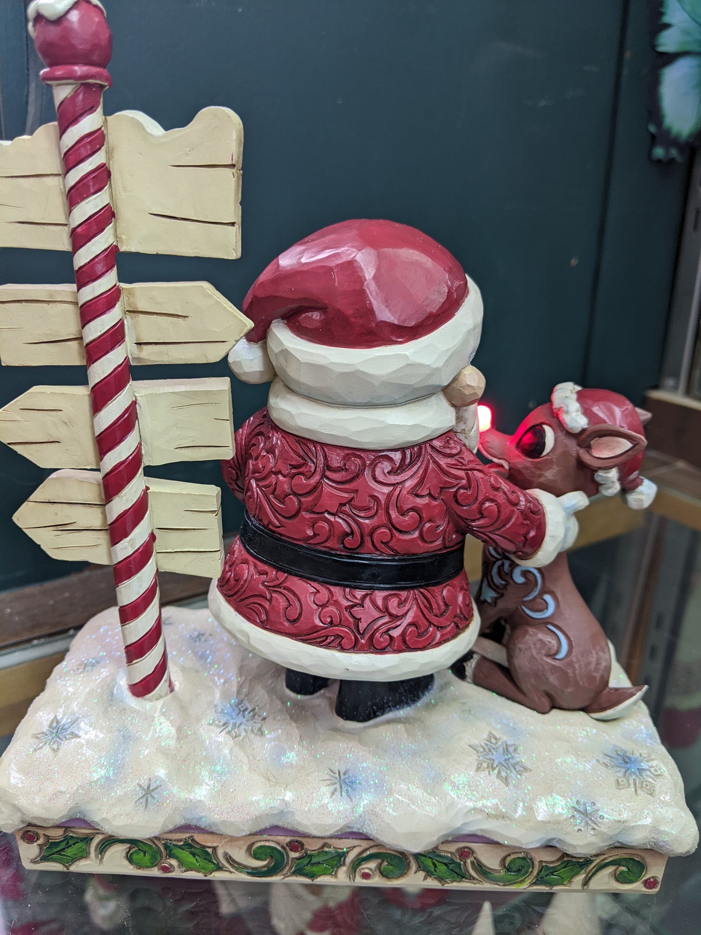 Rudolph and Santa Next to Signpost by Jim Shore