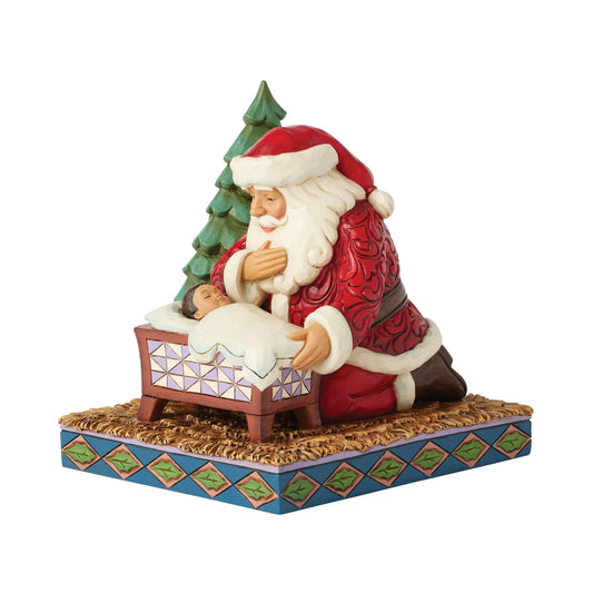 Santa Kneeling by Baby Jesus