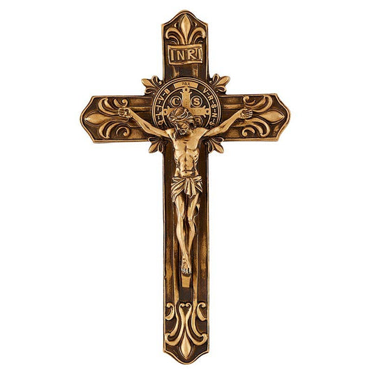Bronze crucifix with detailed design on a white background